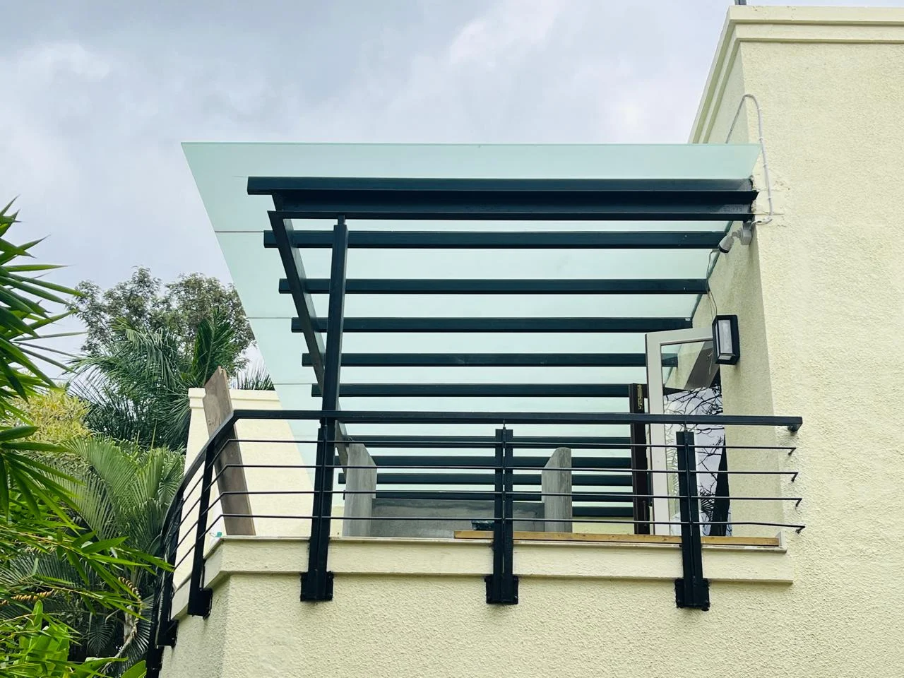 Custom glass partition hardware detailing and finish